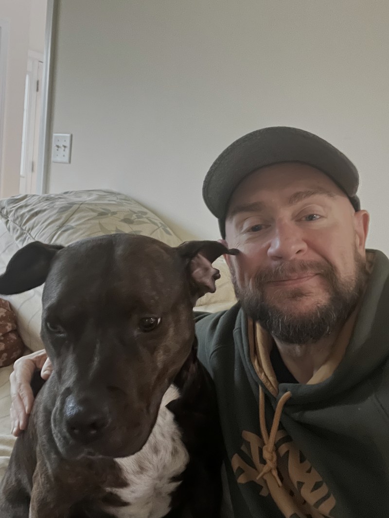 Paul Moriarty with his dog at home